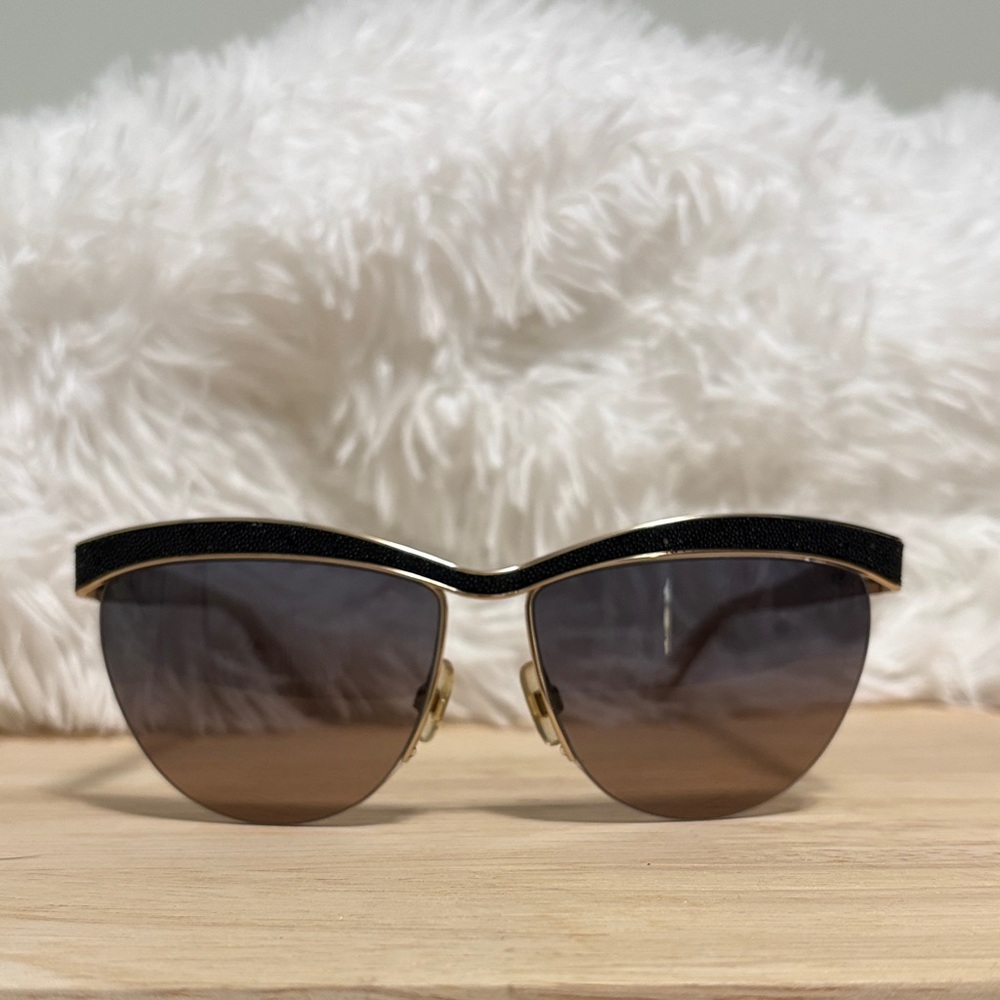 SWAROVSKI: Elegant Black and Gold Sunglasses